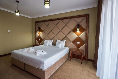 Katil atau katil-katil dalam bilik di HOTEL ADRIANO