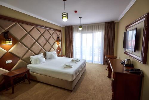 Postel nebo postele na pokoji v ubytování HOTEL ADRIANO