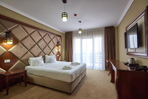Ліжко або ліжка в номері HOTEL ADRIANO