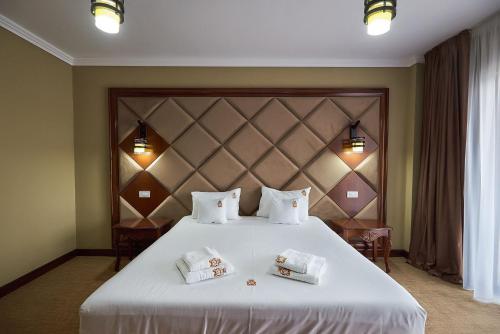 Katil atau katil-katil dalam bilik di HOTEL ADRIANO