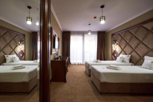 Katil atau katil-katil dalam bilik di HOTEL ADRIANO