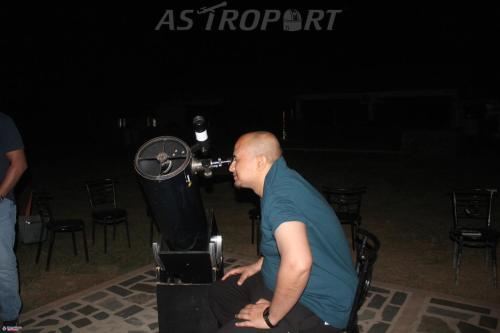 a man sitting in front of a microphone at Astroport Sariska Treetop by Eight Continents in Tehla