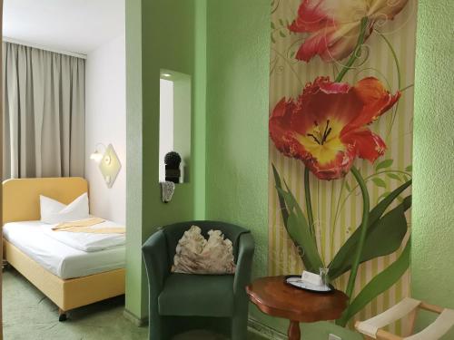 En eller flere senger på et rom på Boulevardhotel Sängerstadt - alle Zimmer klimatisiert