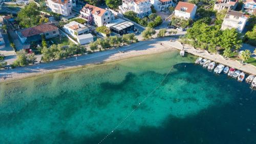 an aerial view of a beach with boats in the water at Apartments Endless summer in Srima