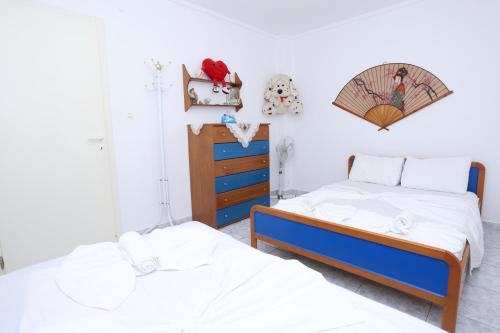 Ένα ή περισσότερα κρεβάτια σε δωμάτιο στο Nella Maisonette Hanioti