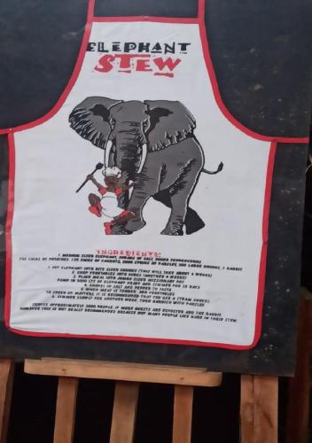 a sign for an elephant stay on a stool at De Rock Jungle Living Resort in Coonoor