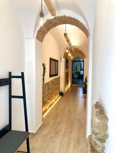 a hallway with an archway in a building at PIEDRA DE LUNA in Merida