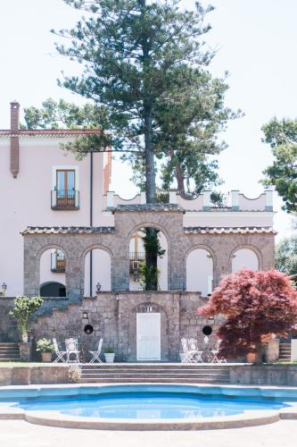 a house with a pool in front of it at Capo Santa Fortunata in Sorrento