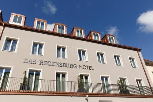 a large white building with the words das resonance hotel at Hotel Das Regensburg in Regensburg