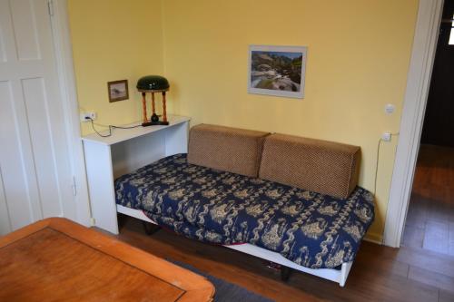 a small room with a bed and a table at Casa Sabina in CH 6616 Losone Tessin in Losone