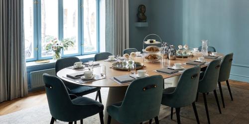 a dining room with a table and chairs at Hotel Diplomat Stockholm in Stockholm