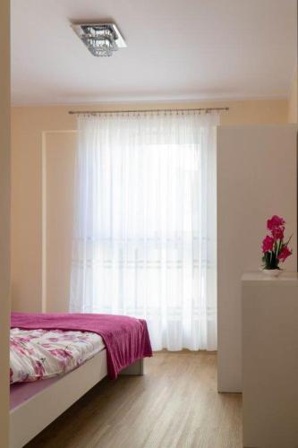 Ένα ή περισσότερα κρεβάτια σε δωμάτιο στο Apartament przy Czarnej