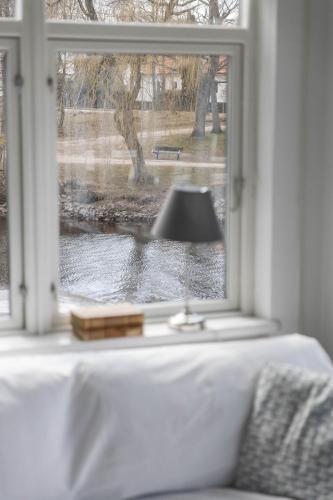 a window with a view of a body of water at Hotell Villa Rönne in Ängelholm