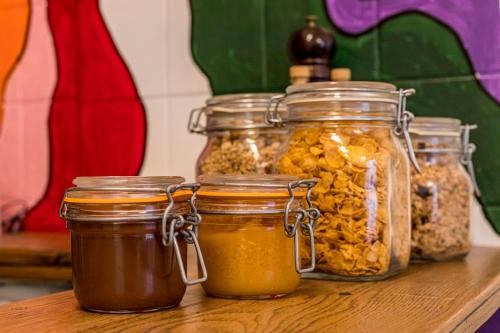 a group of jars of food sitting on a table at B&B Gracht 62 in Maastricht