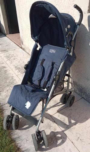 a blue baby stroller sitting on the sidewalk at Casa Diso 2016 in Vittorio Veneto
