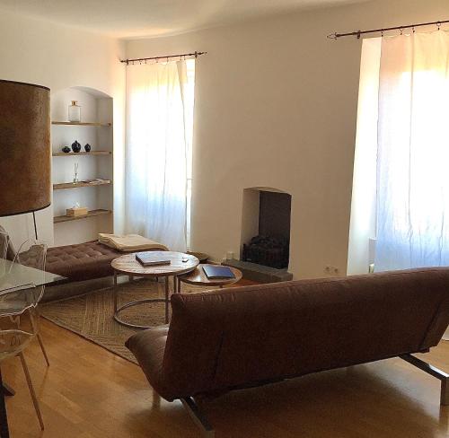 a living room with a couch and a table at Chez Andrea, Centre Historique Ajaccio in Ajaccio