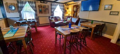 an overhead view of a dining room with tables and chairs at Sportsmans Valley Hotel in Liskeard