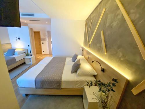 a bedroom with a bed in a room at 16 Lakes Hotel in Grabovac