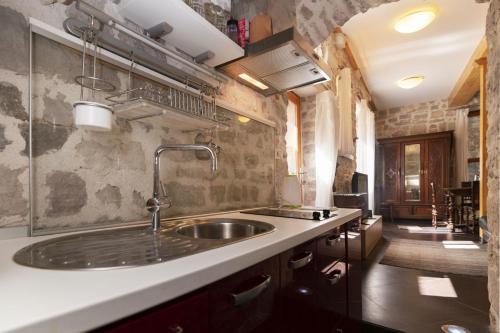 a kitchen with a sink and a counter at Galera in Šibenik