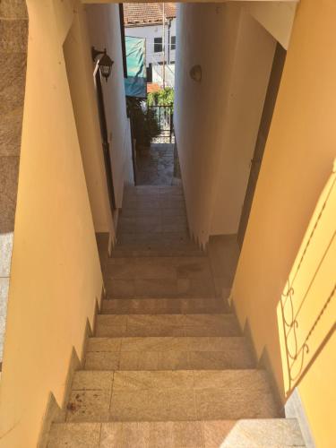 a flight of stairs in a building at CA DE MIN Haut de Villa à Badalucco in Badalucco