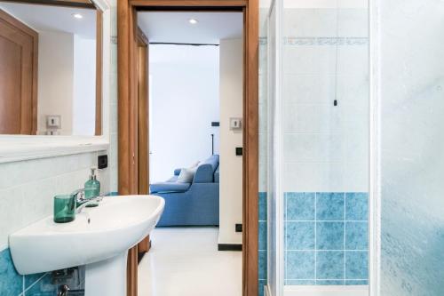 a bathroom with a sink and a glass shower at Nel Cuore di Santa in Santa Margherita Ligure