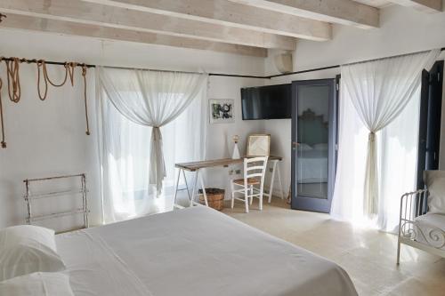 Postel nebo postele na pokoji v ubytování Masseria Prosperi