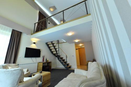 TV o dispositivi per l'intrattenimento presso Villa Luxury Rooms - Wine Resort