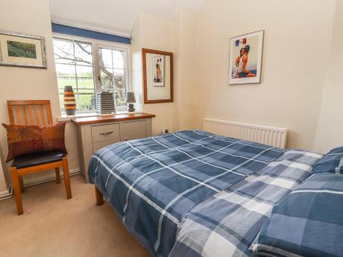 En eller flere senge i et værelse på Castle View Cottage