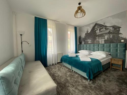 Ένα ή περισσότερα κρεβάτια σε δωμάτιο στο Mikołajek