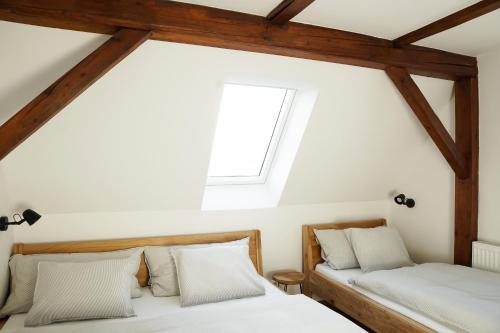 Postel nebo postele na pokoji v ubytování Apartmány Winkler