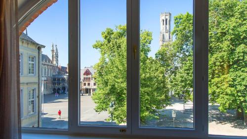 an open window with a view of a city street at Crowne Plaza Hotel Brugge by IHG in Bruges