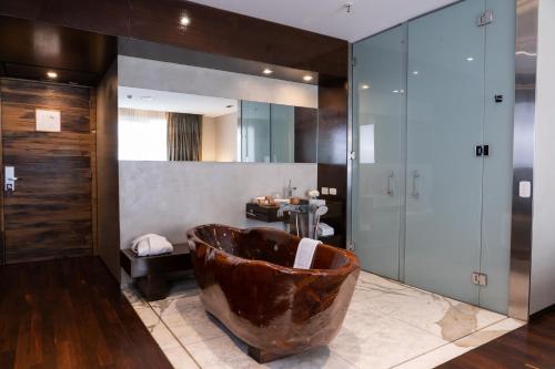 a bathroom with a large tub and a sink at Mio Buenos Aires in Buenos Aires