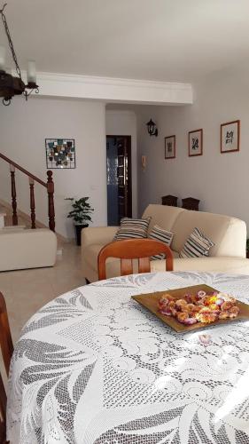 a slice of pizza on a table in a living room at Villa Ciriaco Sea Star in Ericeira