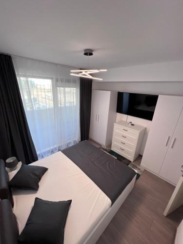 מיטה או מיטות בחדר ב-Fiesta Apartments