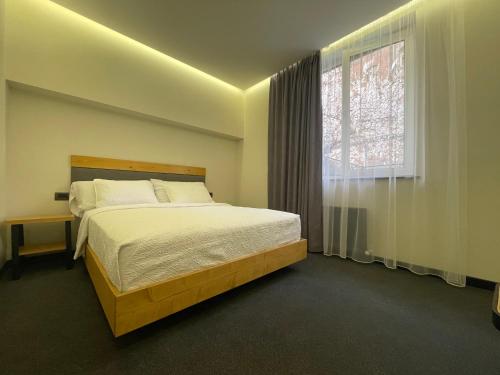 Postel nebo postele na pokoji v ubytování MIST Boutique Hotel