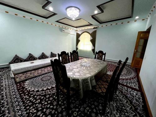 a dining room with a table and chairs at XIVA AZIM OTA in Khiva