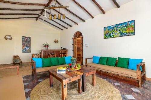 a living room filled with furniture and a couch at Marafiki Beach Hotel & SPA in Matemwe