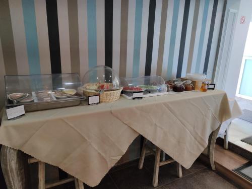 a table with a buffet of food on it at Filoxenia Hotel Monemvasia in Monemvasia