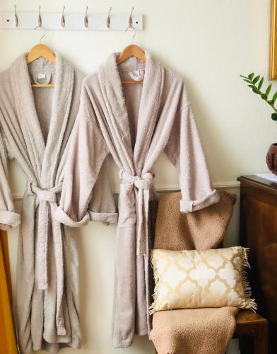 a rack of towels hanging on a wall at Quinta Pereirinha Farm - A Private 3 Bedroom Vacation Home, Close to Hiking w Ocean Views - Pico Island, Azores in São Roque do Pico