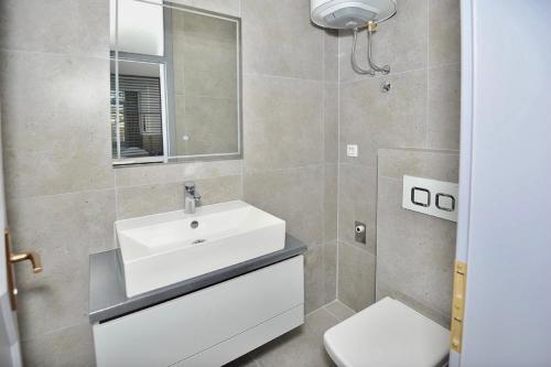 Ванна кімната в Rondo Premium Apartments