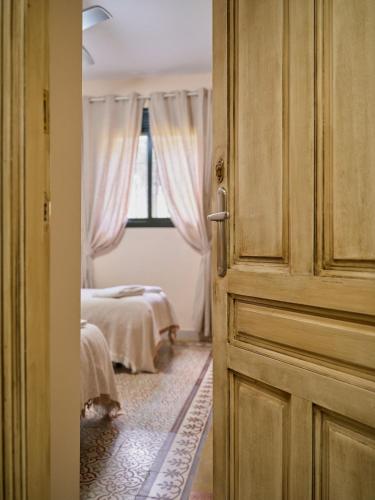 an open door to a bedroom with a bed at VILLA BASILIO in Constantina