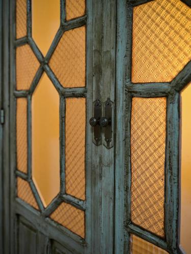 an old door with stained glass on it at VILLA BASILIO in Constantina