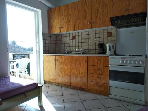 Kuchyňa alebo kuchynka v ubytovaní Ton Mari Apartments