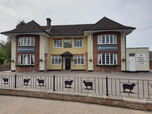 a building with a fence in front of it at Woolpack Inn in Chichester
