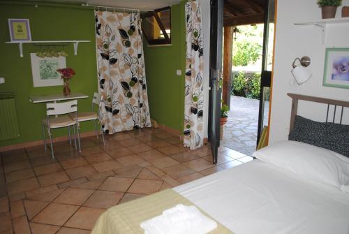 Postel nebo postele na pokoji v ubytování B&B Al Castagneto