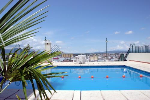 a large swimming pool on the roof of a building at Provincial Plaza Hotel in Salta