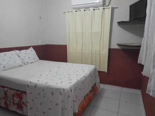 Una cama o camas en una habitación de Pousada Subindo as Dunas