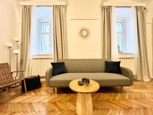 a living room with a couch and a table at Filek House in Sibiu