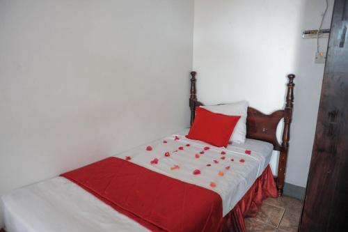Postel nebo postele na pokoji v ubytování Glorianna Hotel