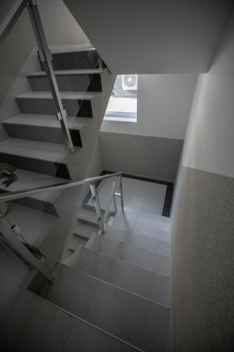 a staircase in a room with a window at Hany Sweet in Niš